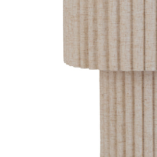 Alcona beige floor lamp beside sofa in warm neutral interior, creating soft diffused lighting.