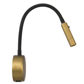 Gold-colored lamp with a flexible black cord on a white background