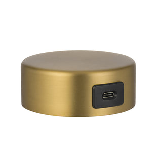 Gold cylindrical device with USB port on a white background