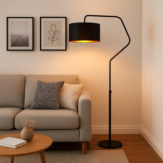 Modern living room with a beige sofa, round coffee table, and black floor lamp.