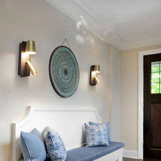 Pair of Serena LED Wall Lights mounted in hallway above bench seat – black and brass finish