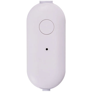 White cylindrical electronic device with a circular button on a white background