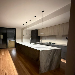Modern kitchen with wooden floor and glass wall