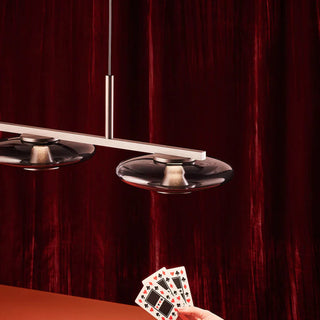 UFO Linear Pendant Light – studio concept shot with red background