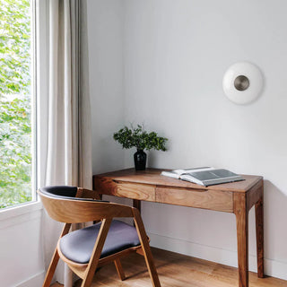 UFO Wall Lamp installed beside wooden desk – interior lifestyle scene