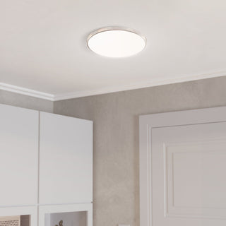 Ceiling light fixture in a room with white walls and a door.