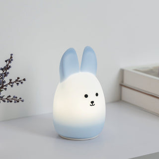 Gradient-colored rabbit-shaped night light on a white surface