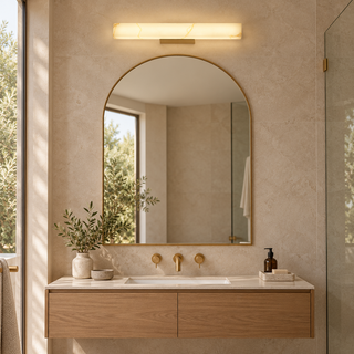 CLA Flecha Angled Medium Wall Light installed in a bathroom over the mirror