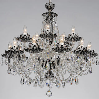 A multi-tiered crystal chandelier with a black metal frame and numerous hanging clear glass teardrop prisms, shown illuminated against a neutral gray background.