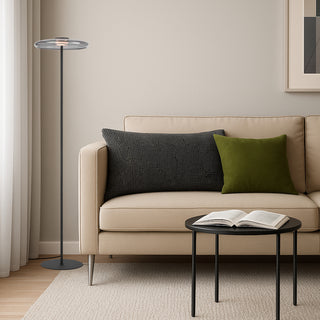 Amity LED floor lamp in black with smoke glass diffuser styled in a contemporary living room.