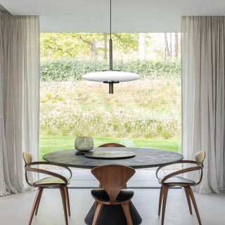 UFO Pendant Light above round dining table – lifestyle interior scene