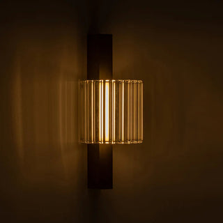Column 250 Wall Lamp illuminated showing warm ambient glow through ribbed glass
