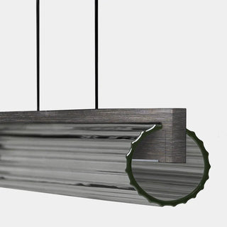 Metallic rectangular object with a textured surface on a white background