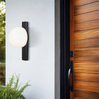 Black Bernay exterior wall light installed beside a modern timber entrance door