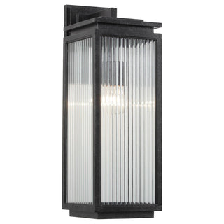 Black outdoor wall light fixture with glass panel on a white background