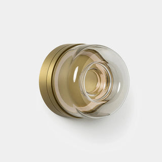 Decorative wall piece with gold and clear glass design on a white background