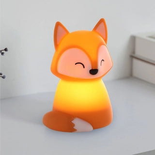 Fox-shaped night light on a white surface