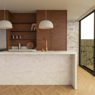Rachis white pendant lights installed above a modern marble kitchen island