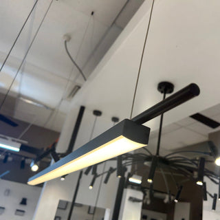 Close-up of Coln Pendant Light illuminated on showroom display