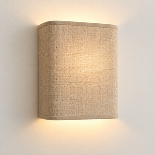 Oatmeal fabric wall light with rounded corners and matching trim, illuminated
