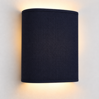 Contessa Midnight fabric wall light with rounded corners and matching trim, illuminated