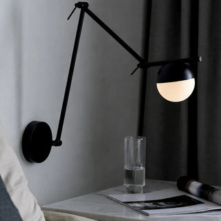 Nordlux Contina Black Wall Light installed next to bedhead in the bedroom