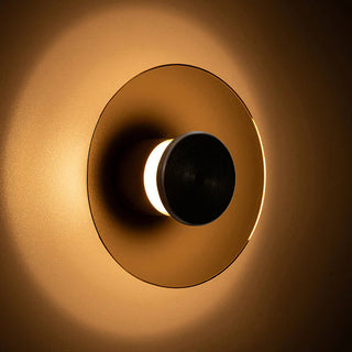 Eclipse 150 Wall Lamp glowing warm amber light on wall