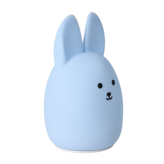 Blue rabbit-shaped night light on a white background