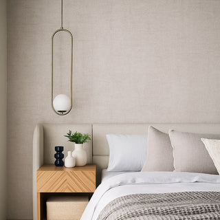 Modern bedroom with a bed, nightstand, and pendant light.