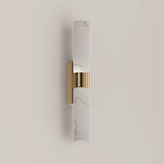 CLA Flecha medium wall light switched off, showing the curved diffuser and ribbed satin brass centre band