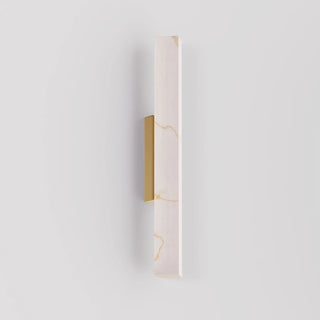 Flecha Angled medium wall light switched off, showing its slim angular profile and frosted marble-effect diffuser.