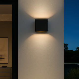 elbix Flip II black exterior LED wall light installed on modern exterior wall at night