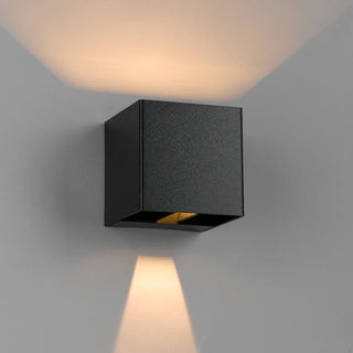 Telbix Flip II exterior wall light in black showing up and down LED beam pattern on outdoor wall