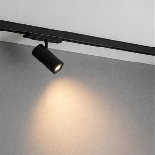 Track light fixture on a ceiling with a neutral background