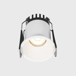 White spotlight with black adjustable head on a light gray background