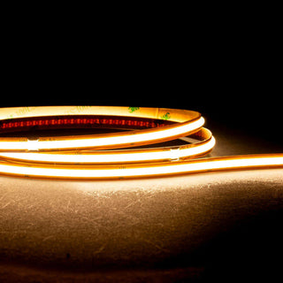 Coiled LED strip light on a dark background