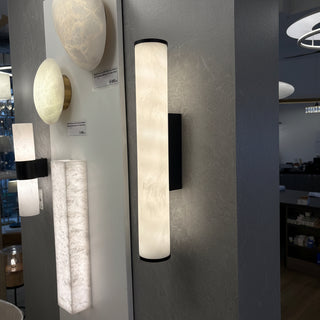 Tubula marble look wall light installed in Davoluce Lighting showroom