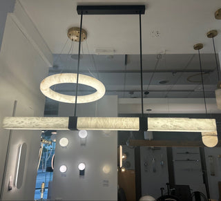 Modern pendant lights hanging in a showroom setting
