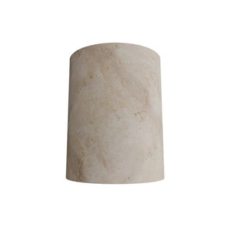 Beige cylindrical stone object on a white background