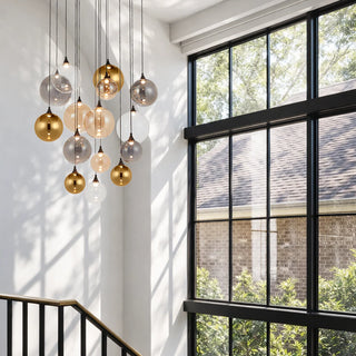 Telbix Kupla 15 light cluster pendant installed in stairwell with mixed glass spheres and black ceiling plate