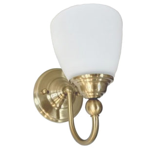 Brass wall sconce with a white glass shade on a white background