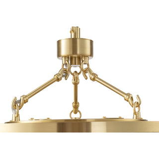 Brass pendant light fixture on a white background