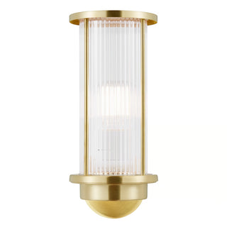 Gold outdoor wall light fixture with clear glass cover on a white background