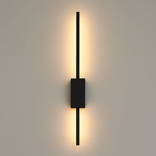 Modern black wall sconce on a neutral gray background