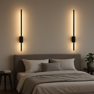 Modern bedroom with a bed, nightstands, and wall sconces.