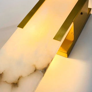 Modern wall-mounted light fixture with marble-like finish