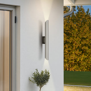 Penros 2 Light in Stainless Steel illuminating outdoor entryway in a contemporary home.