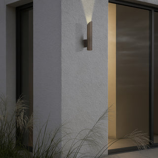 Penros 1 Light in Antique Brass on outdoor wall, highlighting architectural features.