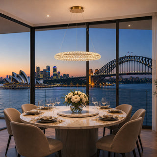 Dining room with a table set for dinner, featuring a cityscape view including the Sydney Opera House and Harbour Bridge.