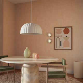 Large Rachis ribbed white dome pendant above a dining table